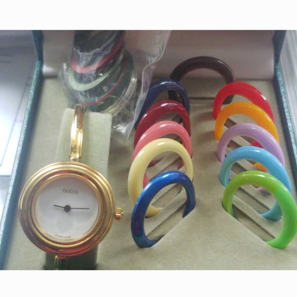 Gucci watch with colorful interchangeable bezels